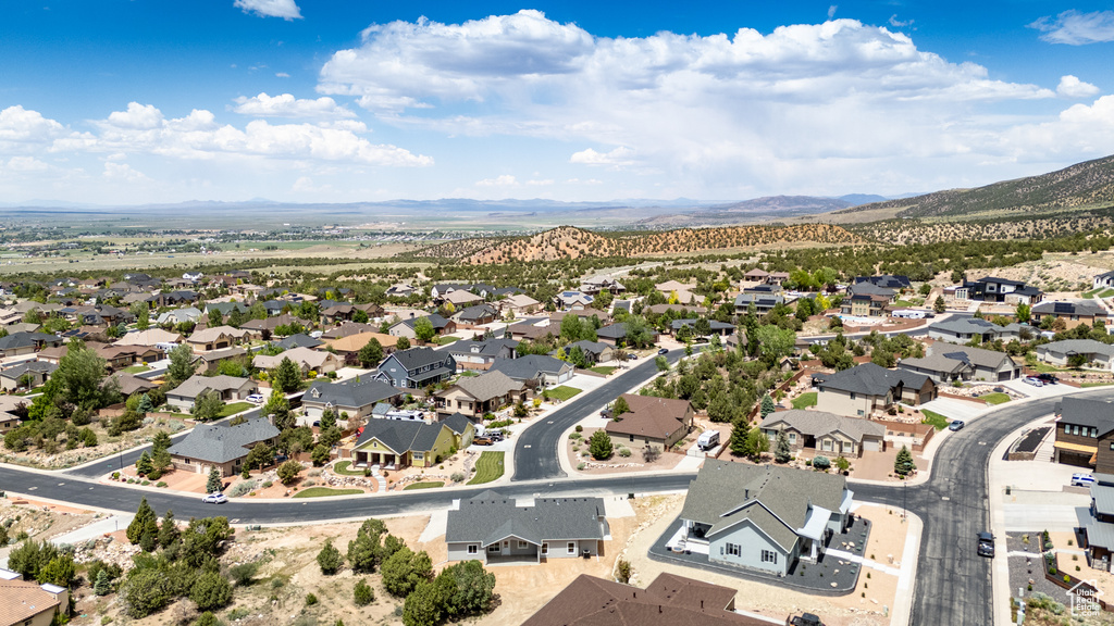Aerial view of residential area featuring a mountain backdrop