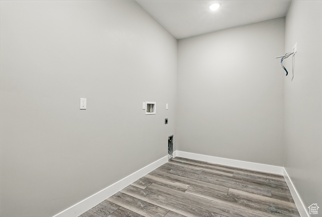 Laundry room with hookup for an electric dryer, wood finished floors, washer hookup, baseboards, and recessed lighting
