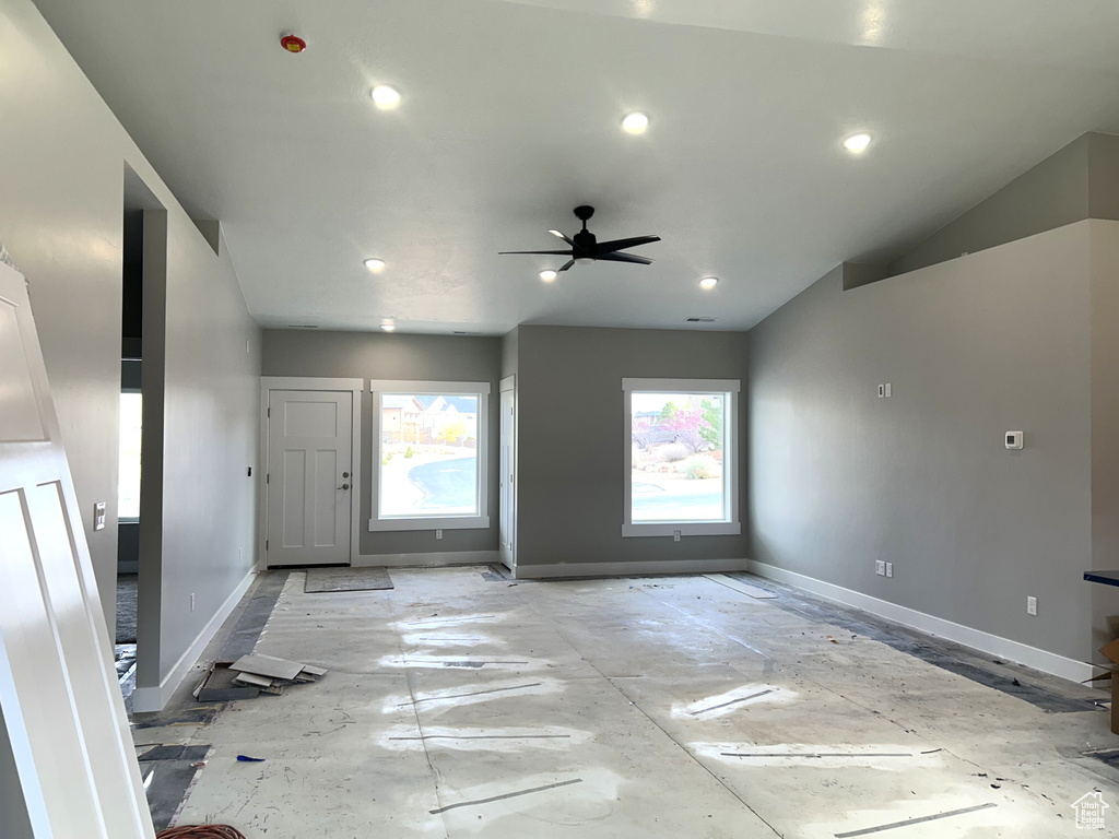 Unfurnished living room featuring baseboards, recessed lighting, and ceiling fan