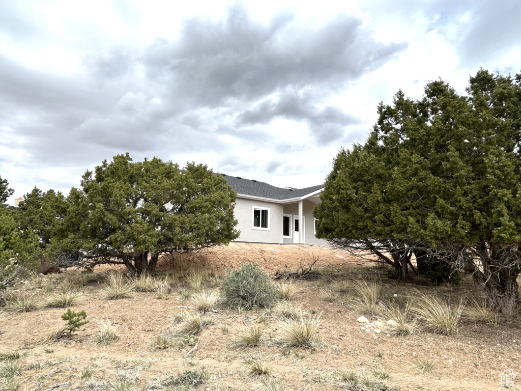 Exterior space featuring stucco siding