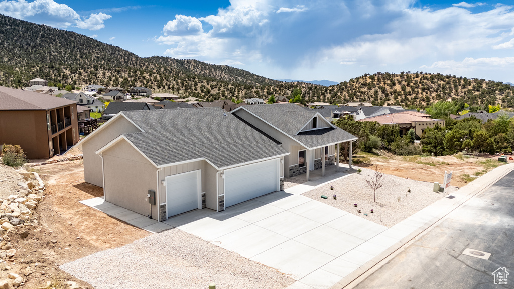 Aerial view of residential area featuring mountains