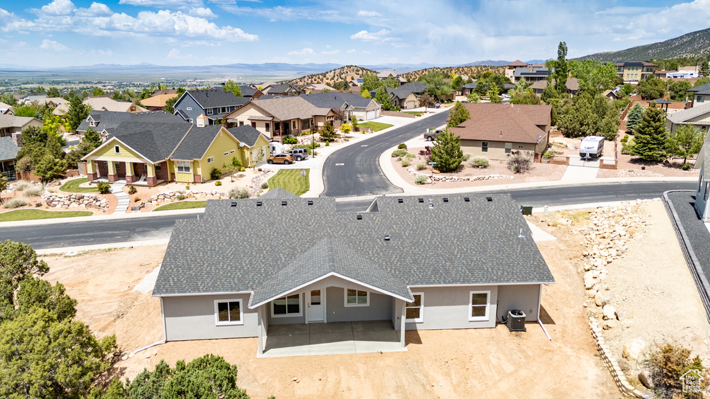 Aerial view of residential area featuring mountains