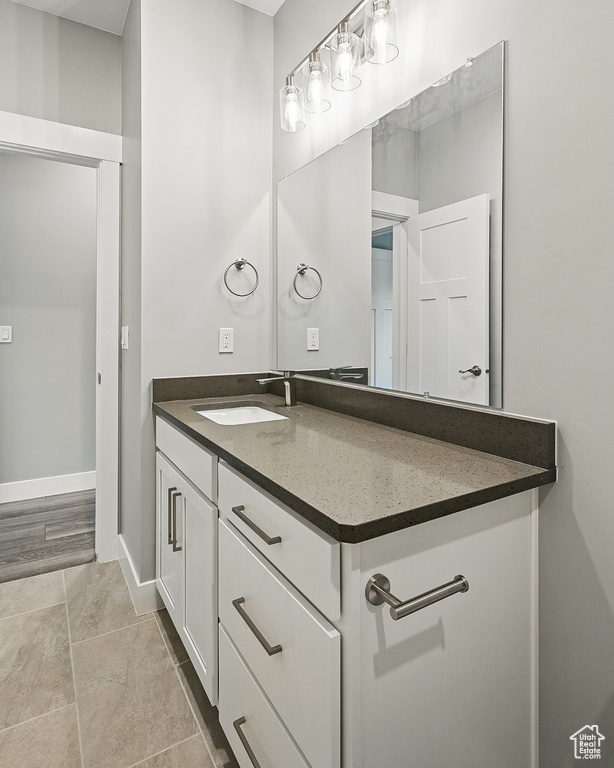 Bathroom featuring vanity and baseboards