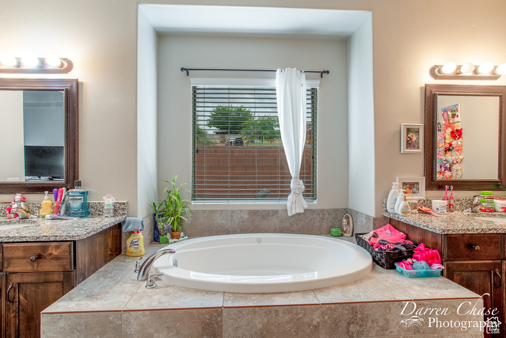 Full bath with a garden tub and vanity