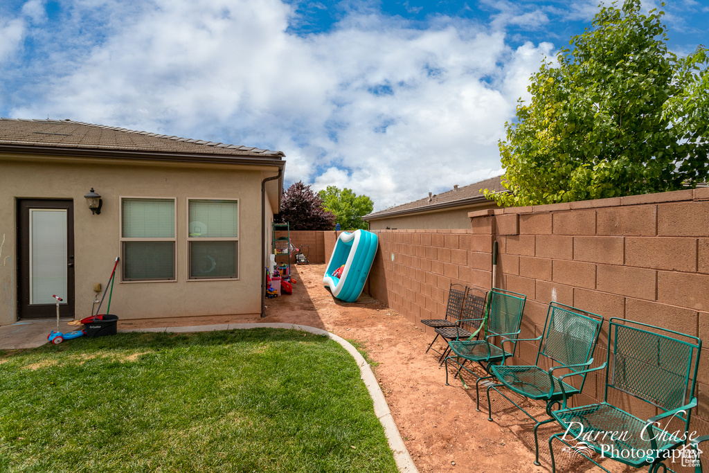 View of yard featuring a fenced backyard