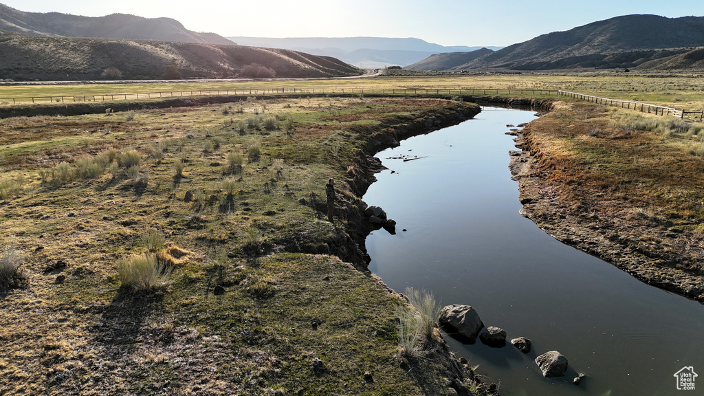 View of mountain background with a nearby body of water