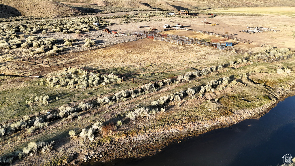 Aerial overview of property's location featuring rural landscape and a large body of water