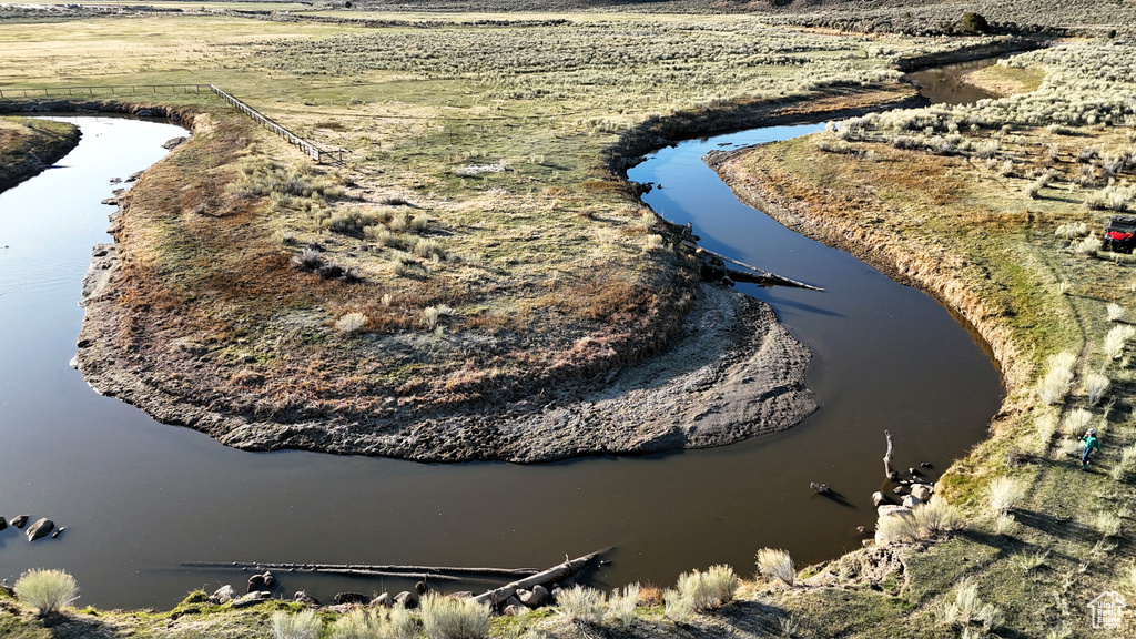 Aerial view of property's location featuring a large body of water