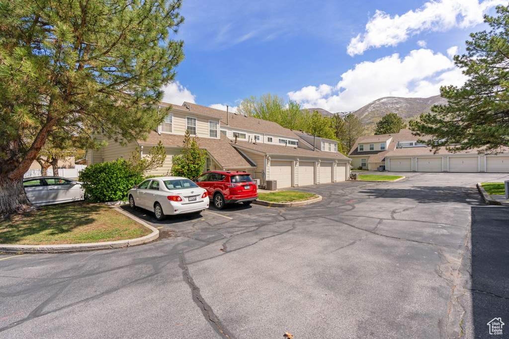 View of front facade featuring community garages and a mountain view