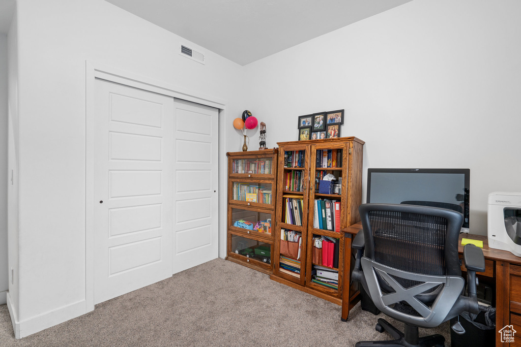 Office space featuring carpet flooring and visible vents