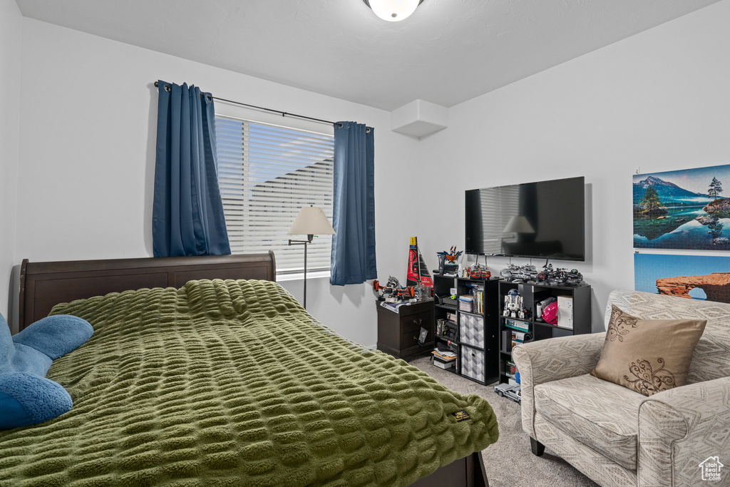 Bedroom featuring carpet flooring