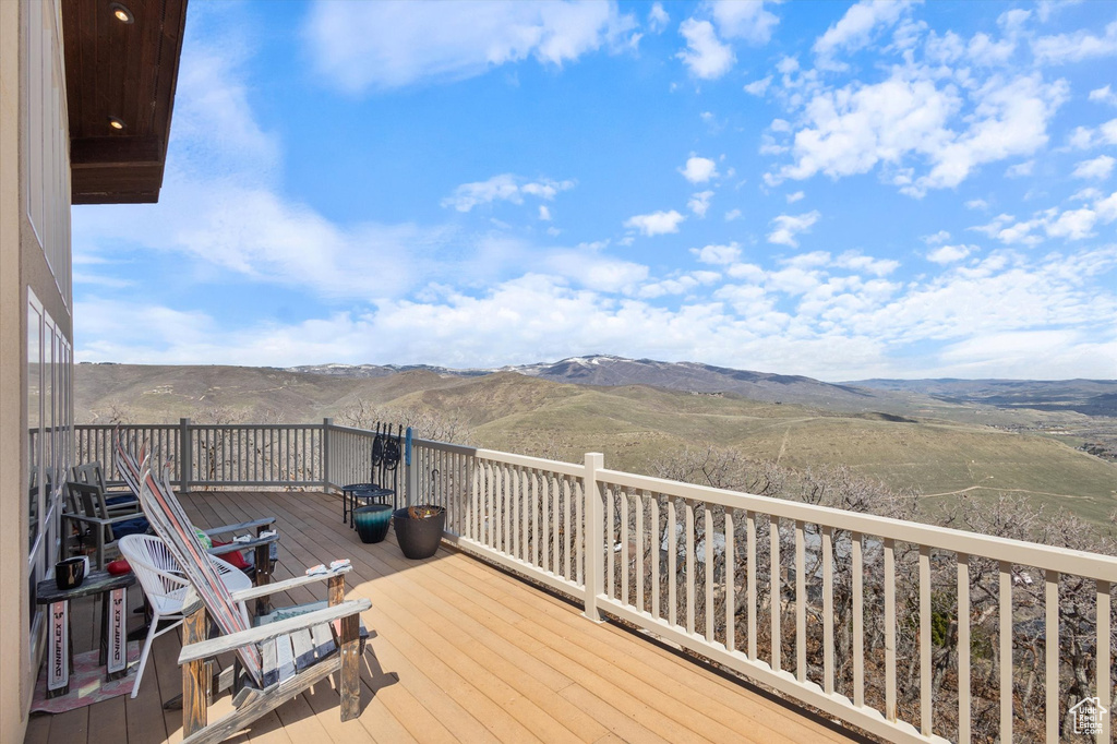 Wooden deck featuring a mountain view