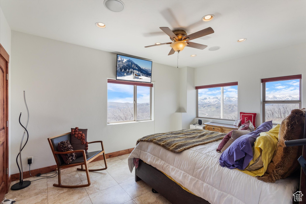 Bedroom featuring recessed lighting, baseboards, and multiple windows
