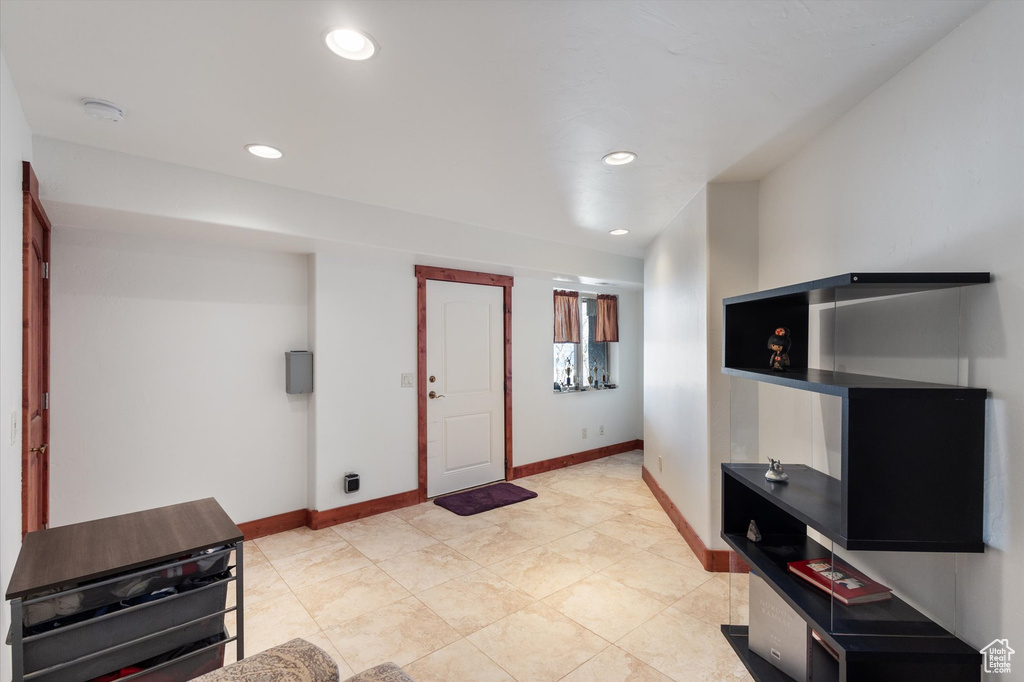 Entryway featuring baseboards and recessed lighting
