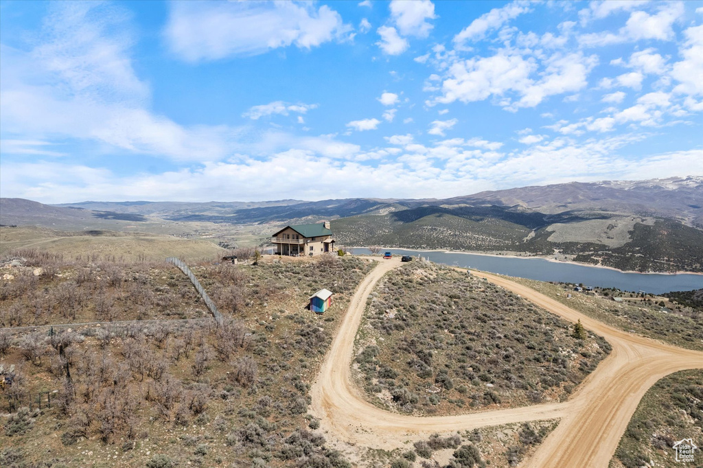 Aerial view featuring a water and mountain view