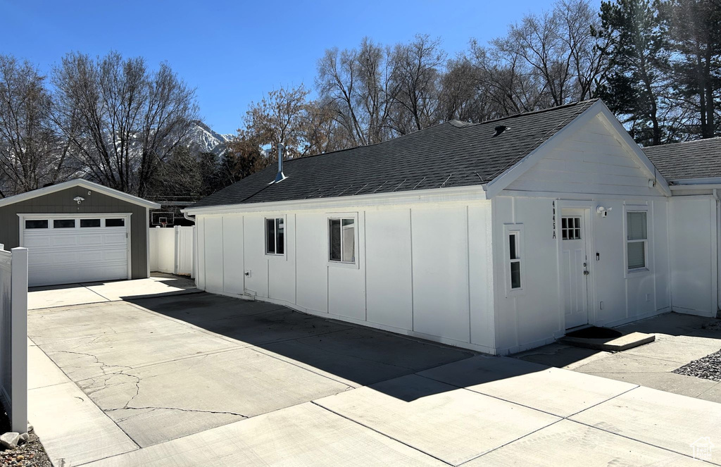 Detached garage featuring driveway
