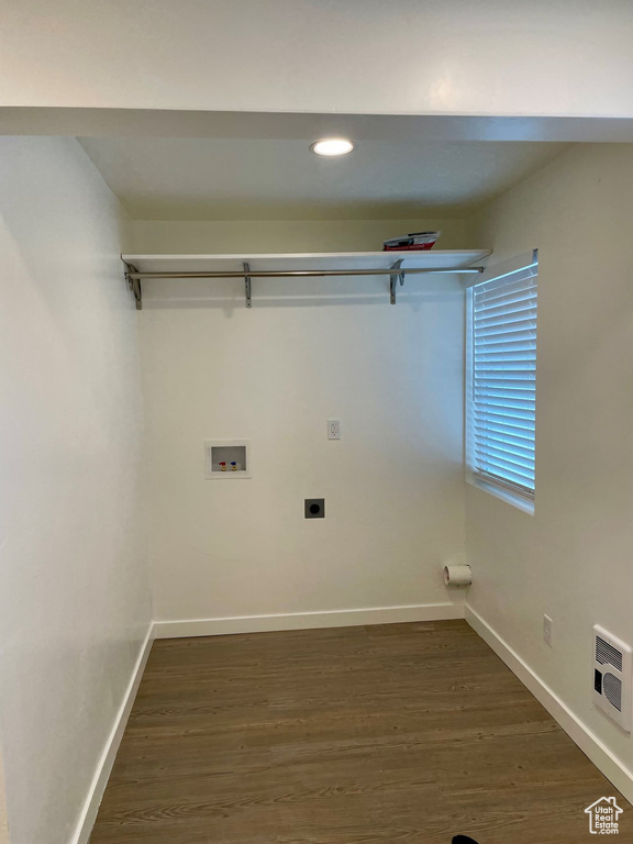 Washroom featuring electric dryer hookup, washer hookup, baseboards, dark wood-style flooring, and recessed lighting