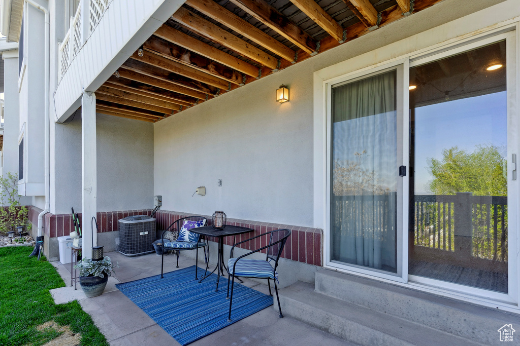 View of patio featuring cooling unit