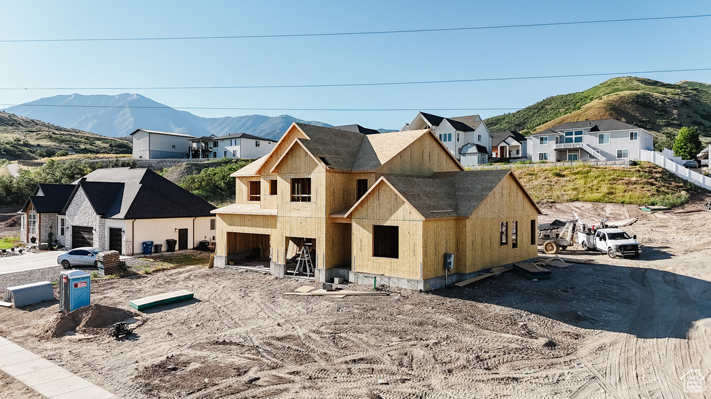 View of front of house featuring a mountain view and a residential view