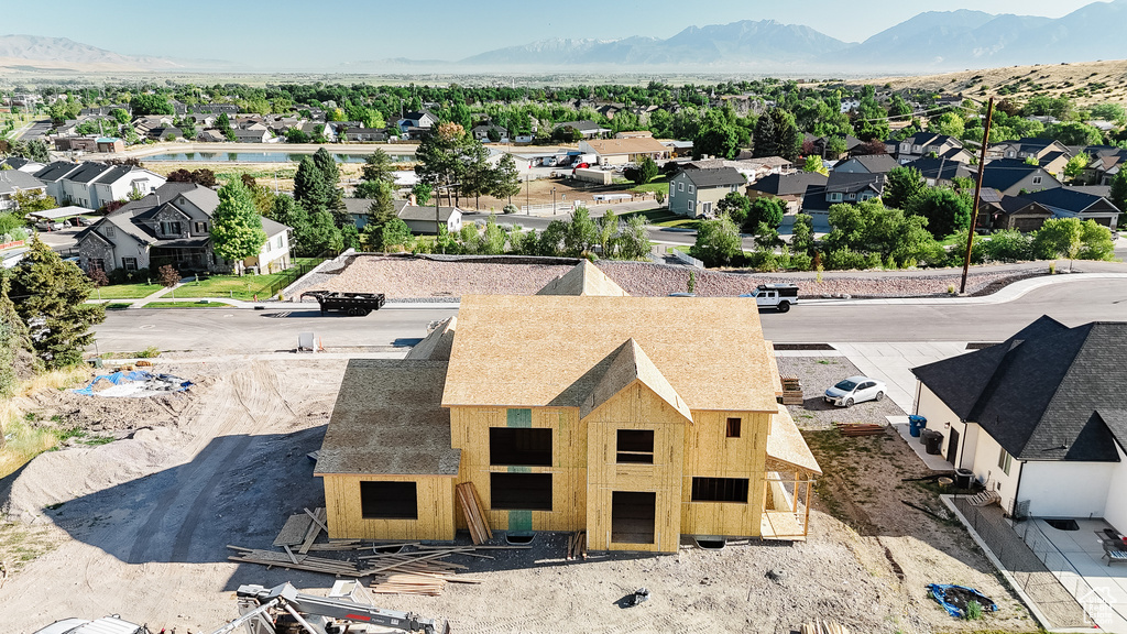 Aerial perspective of suburban area featuring a mountainous background