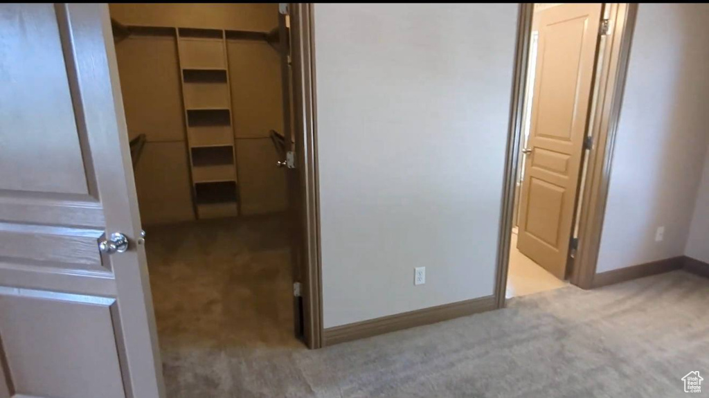 Unfurnished bedroom with carpet and baseboards