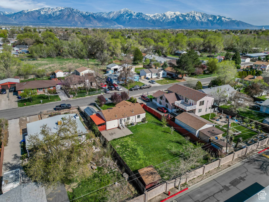 Birds eye view of property with a residential view and a mountain view