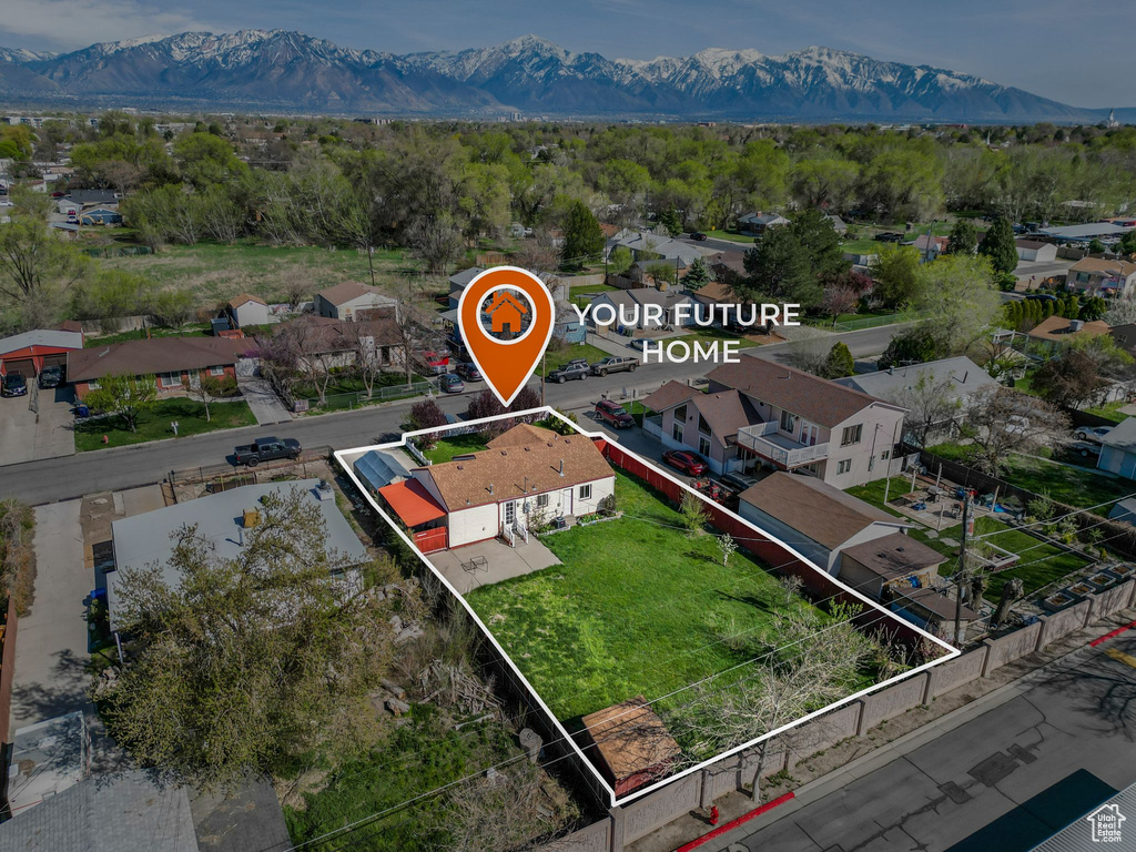 Birds eye view of property with a mountain view and a residential view