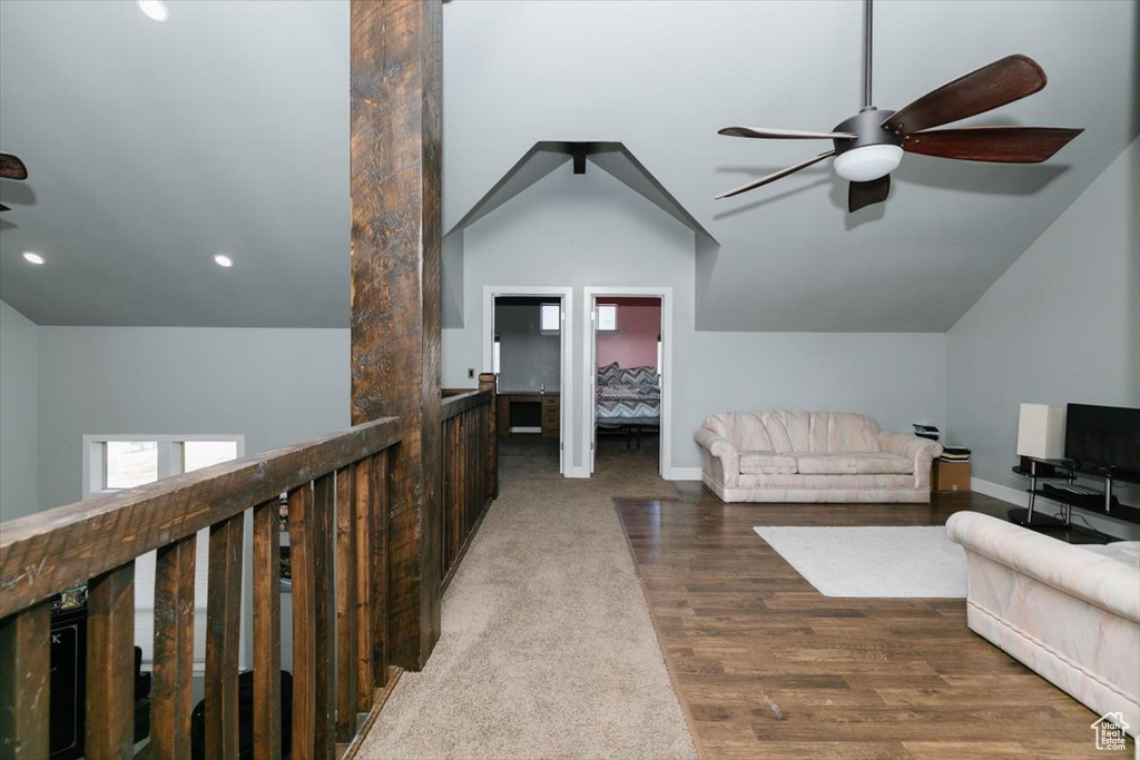 Interior space featuring vaulted ceiling, baseboards, a ceiling fan, and recessed lighting