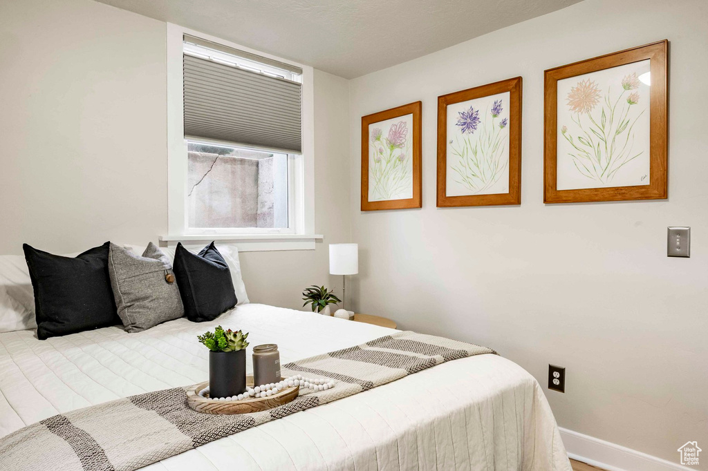 Bedroom featuring baseboards