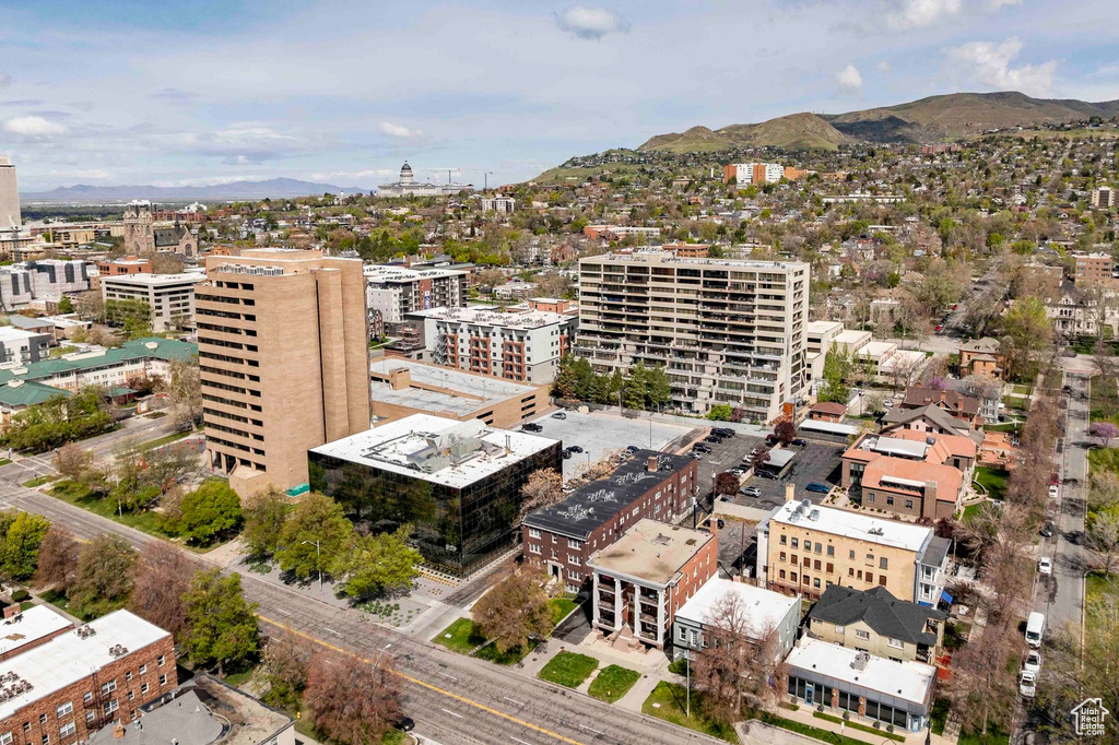 Birds eye view of property with a view of city and a mountain view
