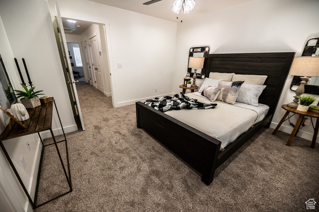 Bedroom featuring baseboards and carpet