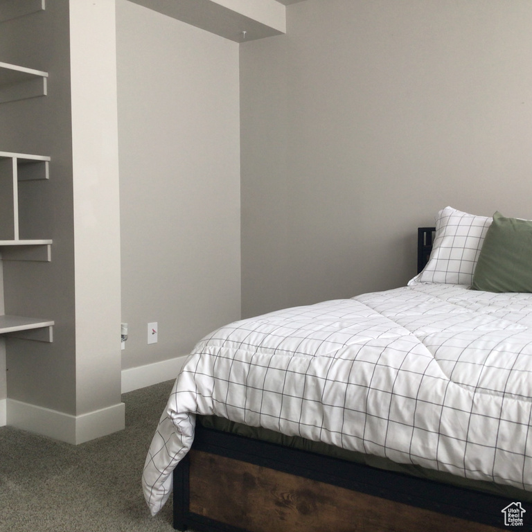 Bedroom with carpet and baseboards