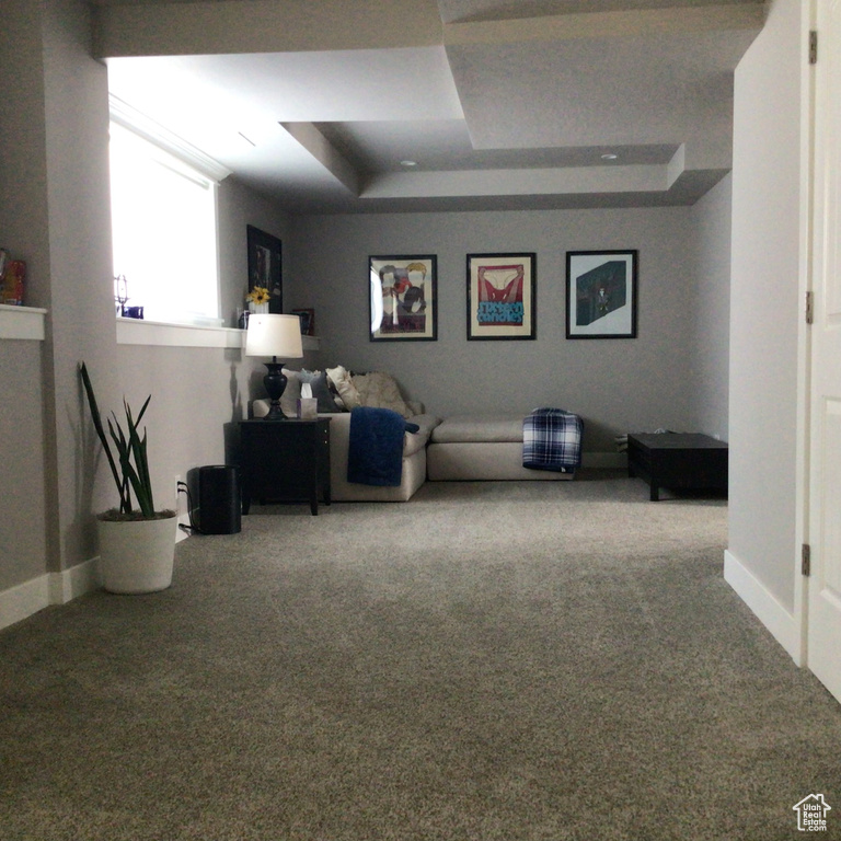 Interior space with carpet floors and baseboards