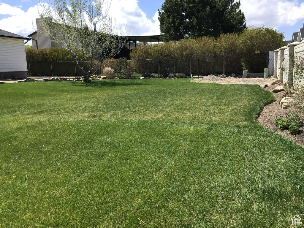 View of yard with fence