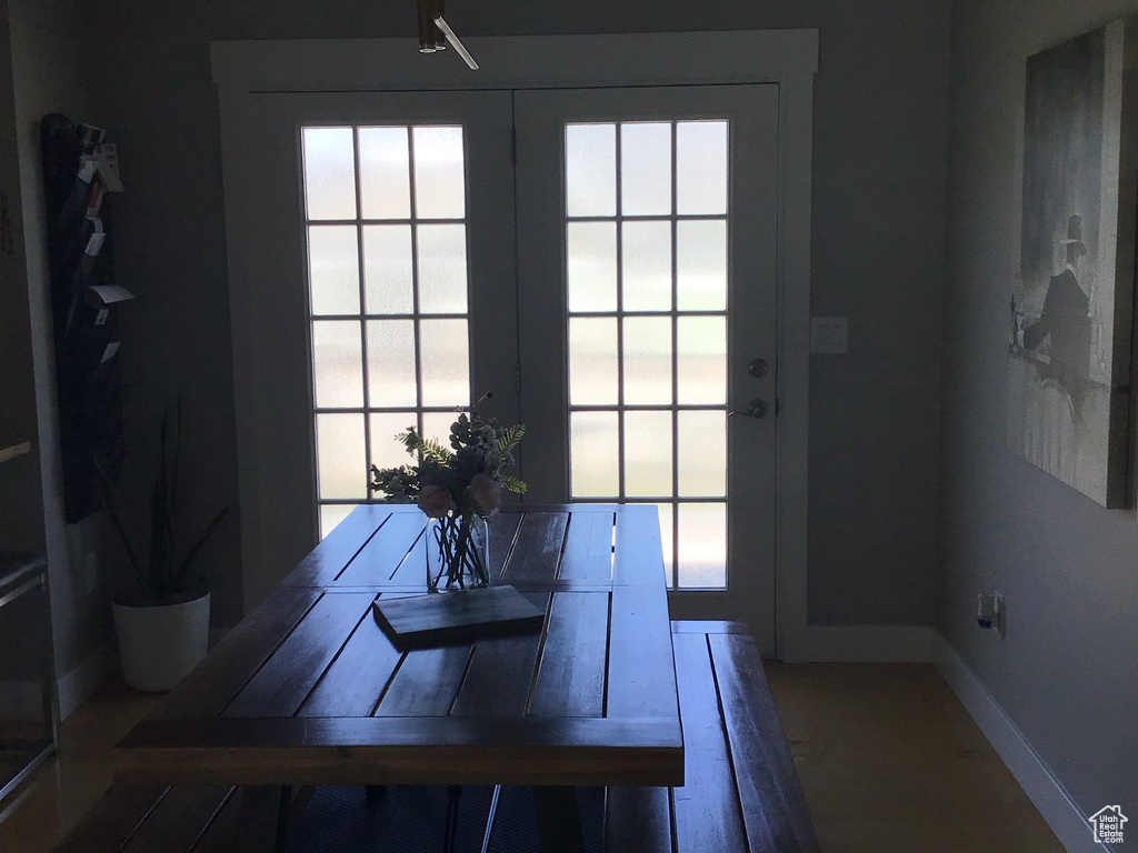 Entryway featuring wood finished floors and baseboards
