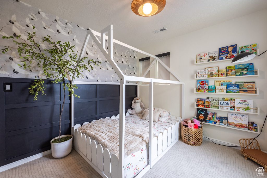 Carpeted bedroom with visible vents