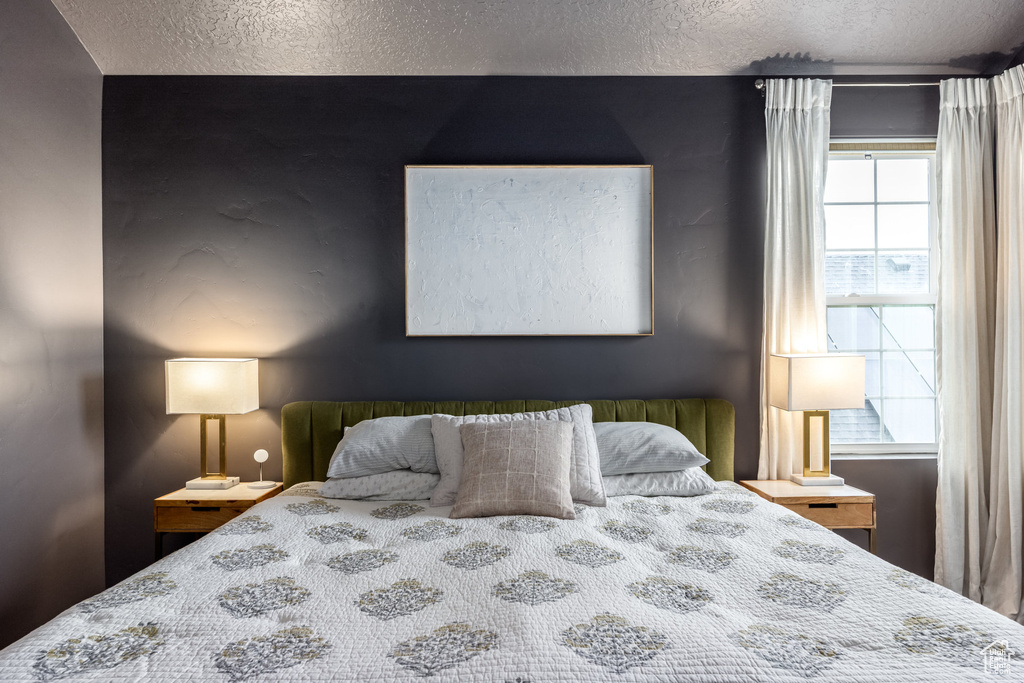 Bedroom featuring a textured ceiling