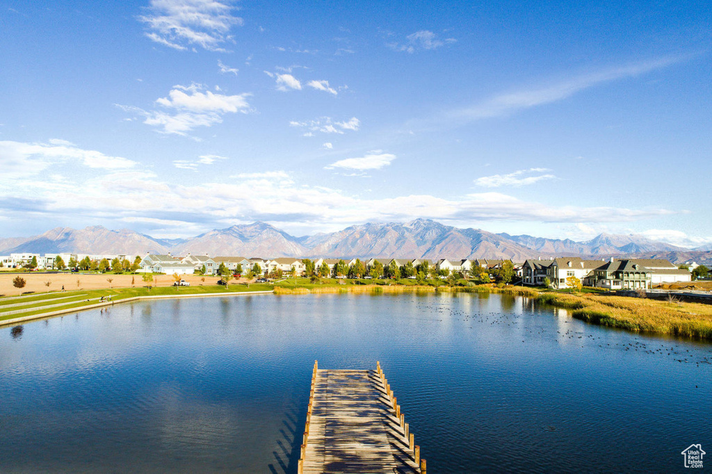View of dock with a water and mountain view