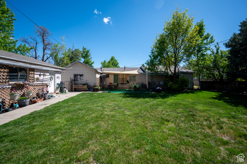 View of yard featuring fence