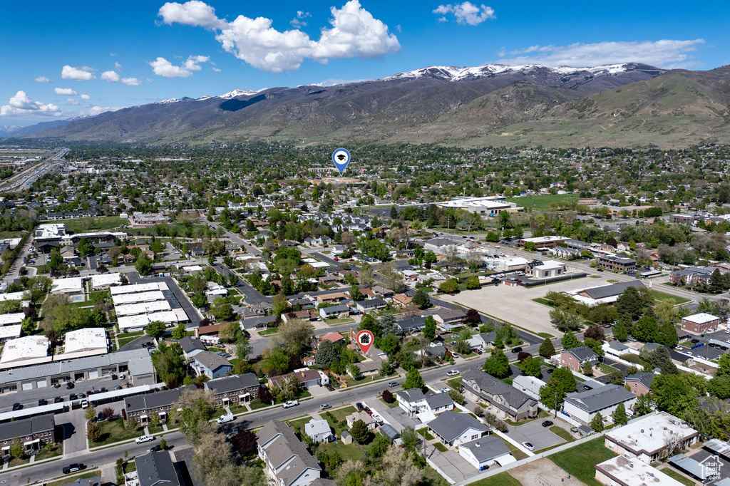 Birds eye view of property with a residential view and a mountain view