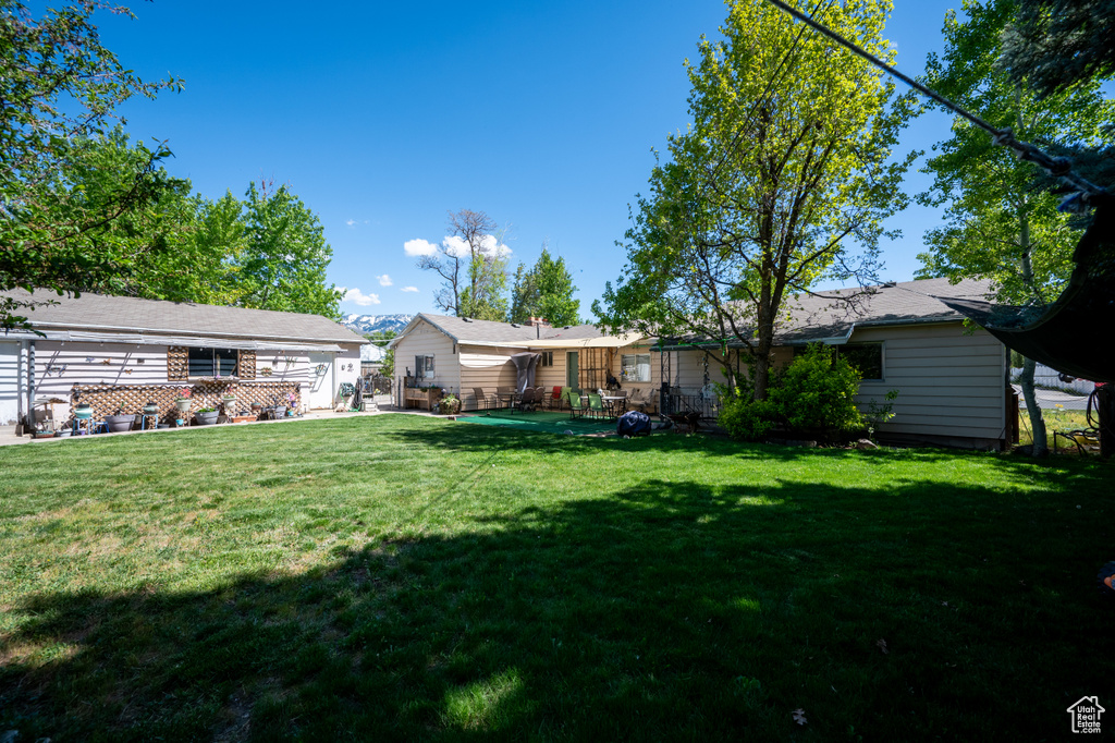 View of yard featuring fence