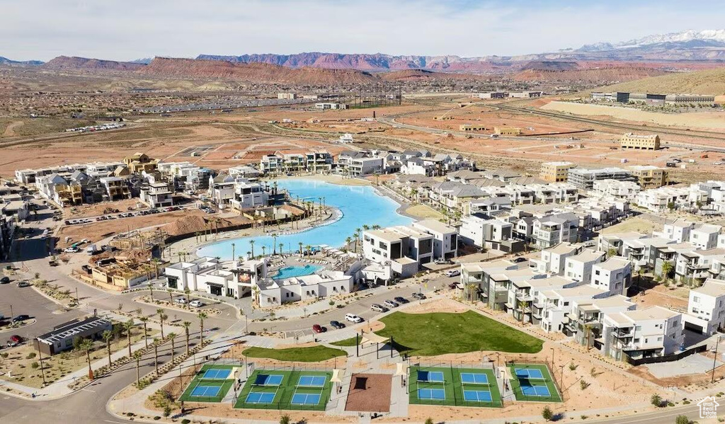 Birds eye view of property with a mountain view