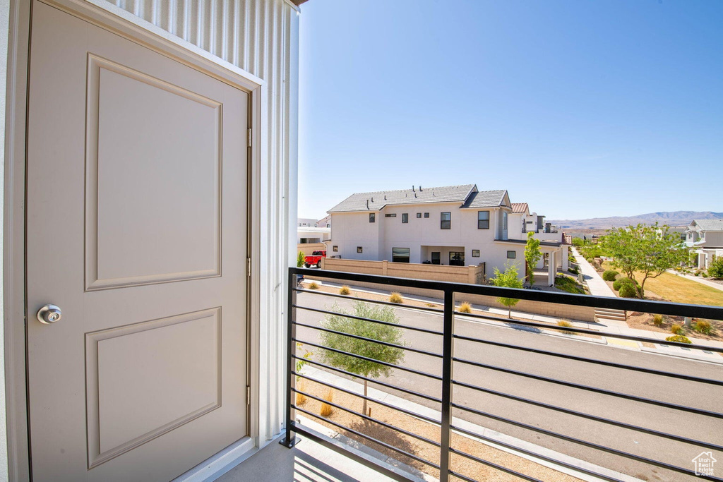 Balcony with a residential view and a mountain view