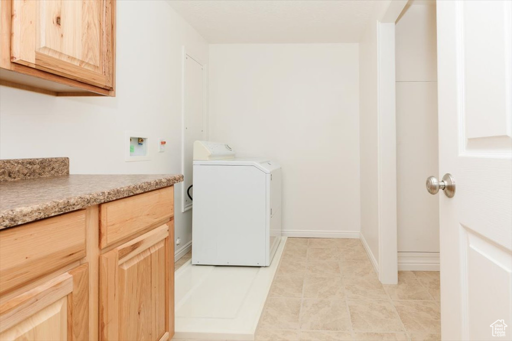 Washroom with washer / dryer and cabinet space