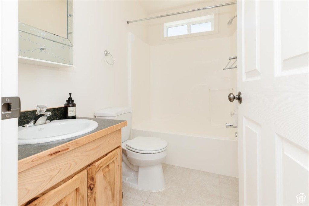 Full bathroom featuring vanity,  shower combination, and tile patterned flooring