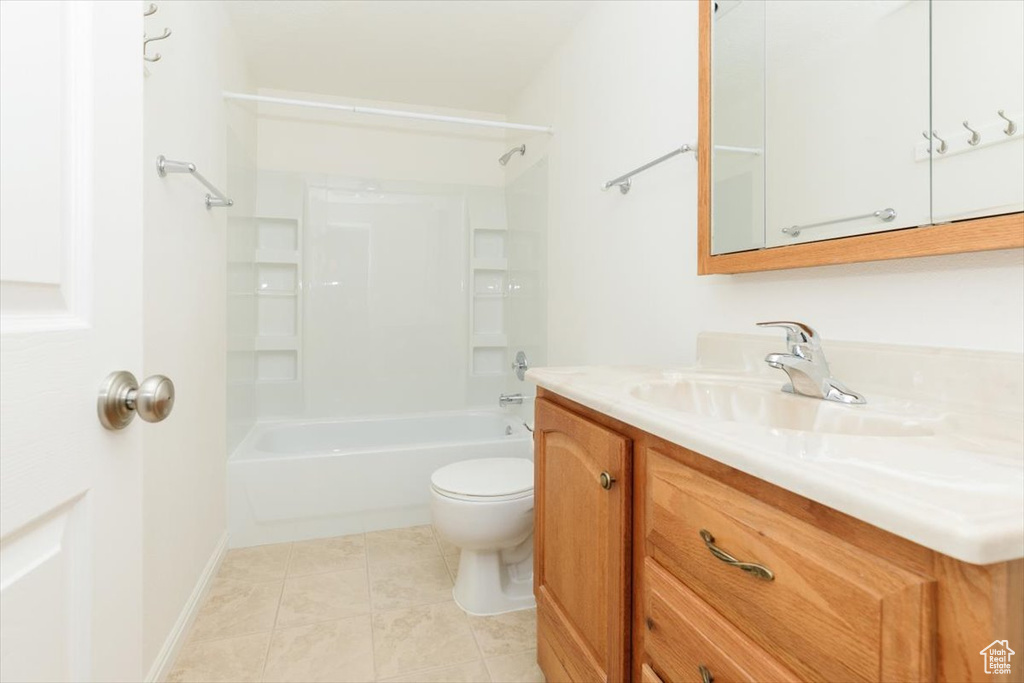 Full bath with vanity, shower / tub combination, and tile patterned floors