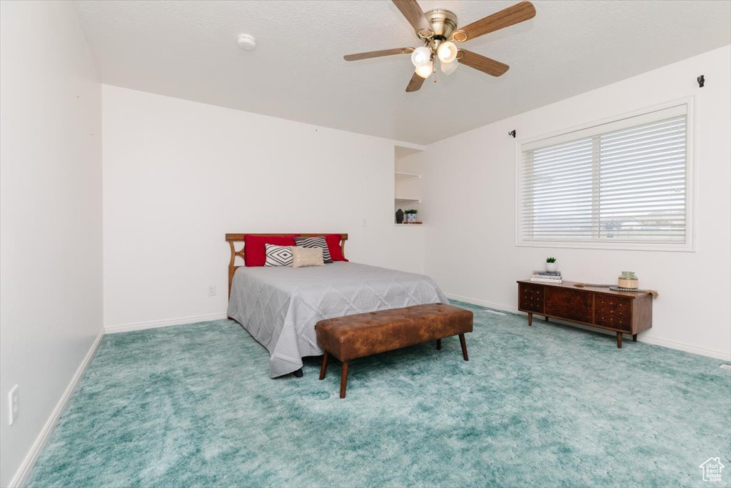 Bedroom with carpet and ceiling fan