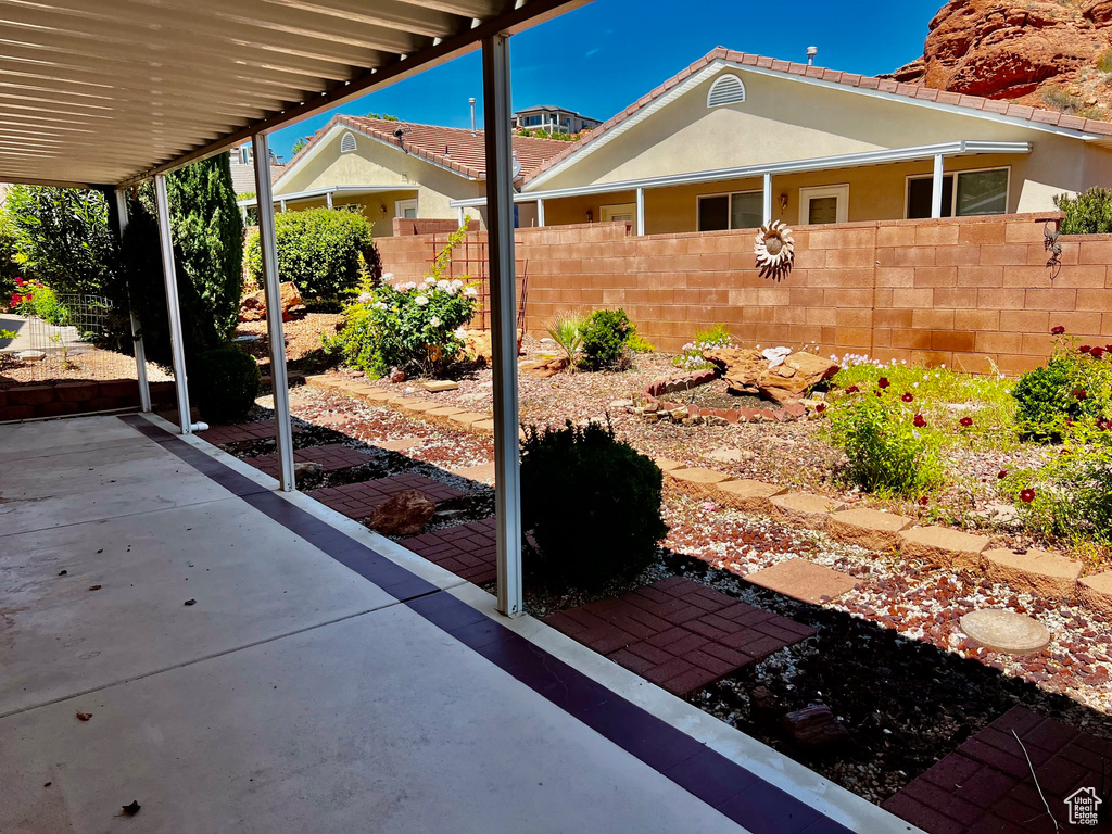 View of patio with fence