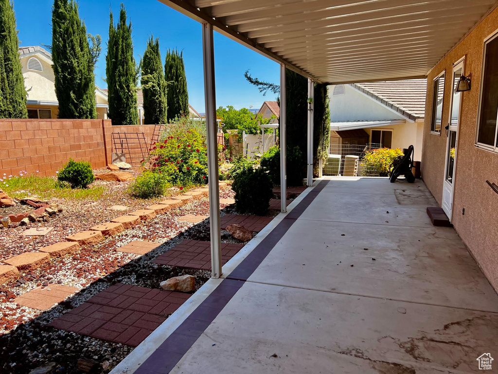 View of patio with fence
