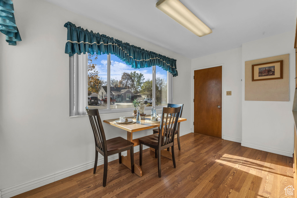 Dining area with wood finished floors and baseboards